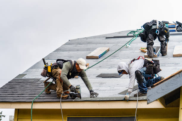 Professional Roof Replacement technician working in Rindge, NH